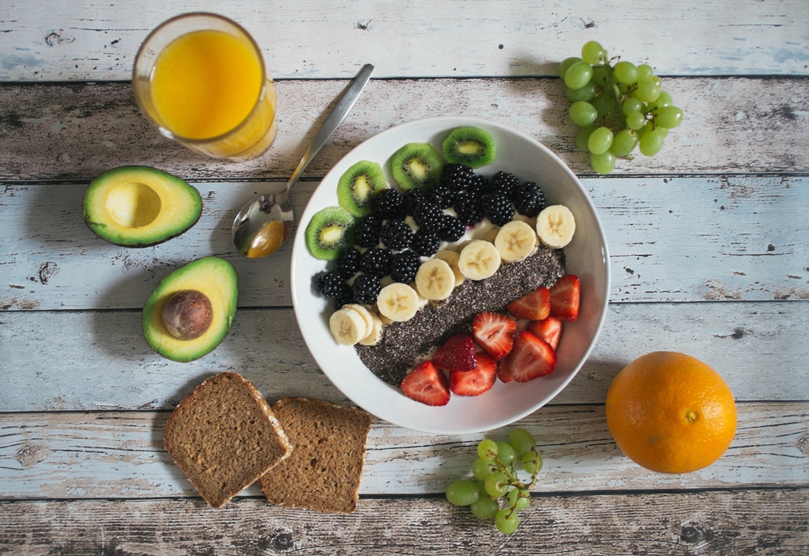 Colorful salad bowl with fresh vegetables and dressing